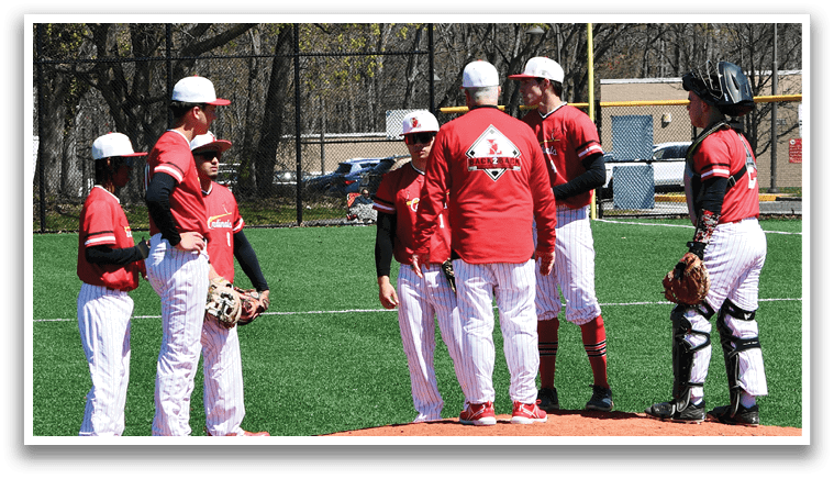 A group of baseball players on a field. Description generated by AI