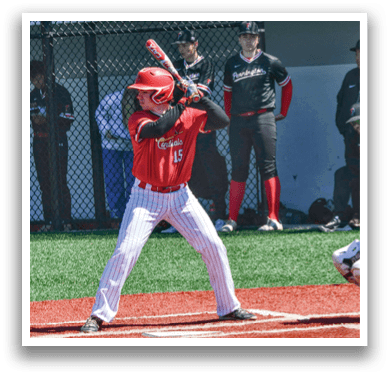A baseball player is holding a bat and getting ready to swing. Description generated by AI