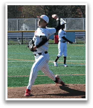 A baseball player in a black and white uniform is pitching a ball. Description generated by AI