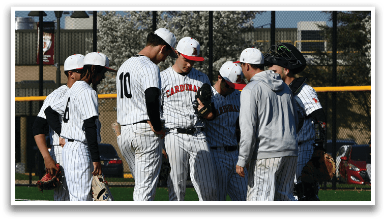 Baseball players wearing red and white uniforms. Description generated by AI