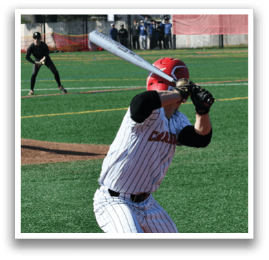 A baseball player is swinging a bat at a ball. Description generated by AI