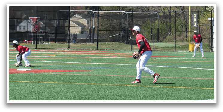 A baseball field with three players. Description generated by AI