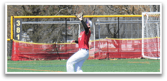A baseball player is at bat, wearing a red shirt and white pants. Description generated by AI