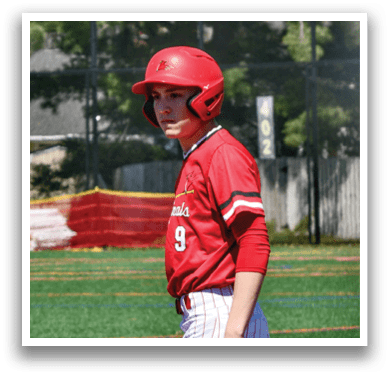 A baseball player wearing a red helmet and jersey. Description generated by AI