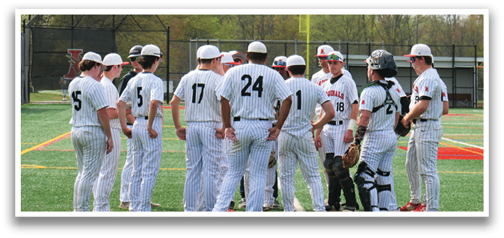 A group of baseball players standing on a field. Description generated by AI