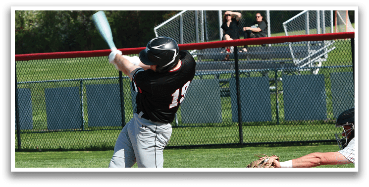 A baseball player is swinging a bat at a ball. Description generated by AI