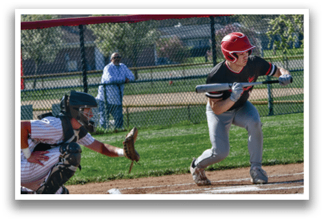 A baseball player is running to first base. Description generated by AI