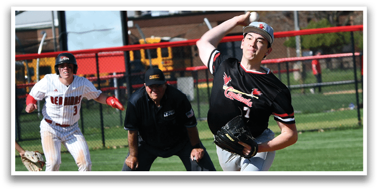 A baseball player in a black shirt and red shoes is pitching a ball. Description generated by AI