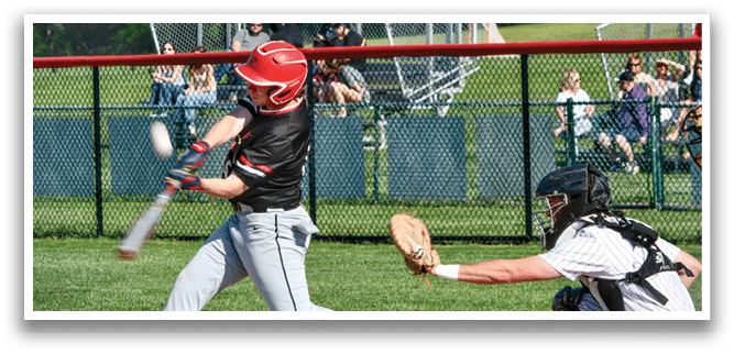 A baseball player is swinging a bat at a ball. Description generated by AI
