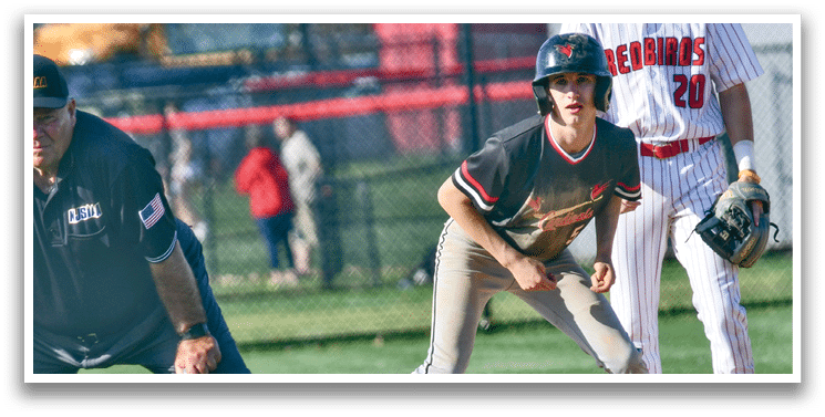 A baseball player is holding a baseball bat. Description generated by AI