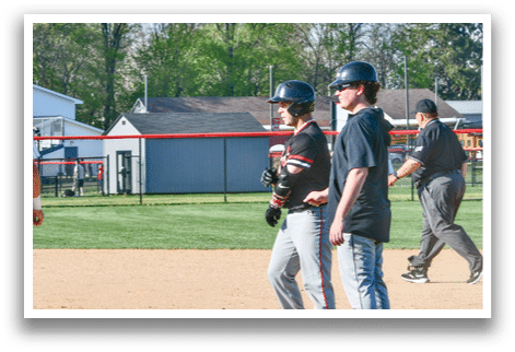 A baseball game is taking place on a field. Description generated by AI
