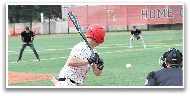 A baseball player is swinging a bat at a ball. Description generated by AI