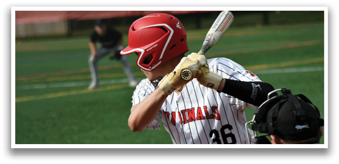 A baseball player wearing a red helmet and a white and black jersey. Description generated by AI
