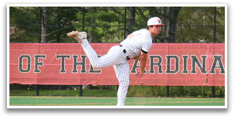 A baseball player in a white and red uniform is pitching a ball. Description generated by AI