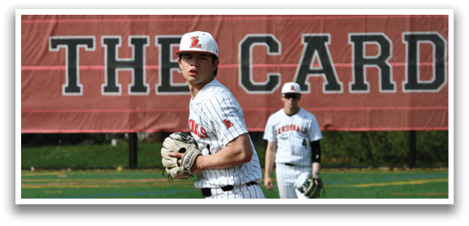 A baseball player in a white and red uniform with a glove on his hand. Description generated by AI