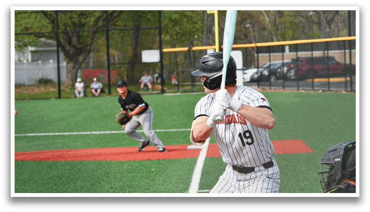 A baseball player is swinging a bat. Description generated by AI