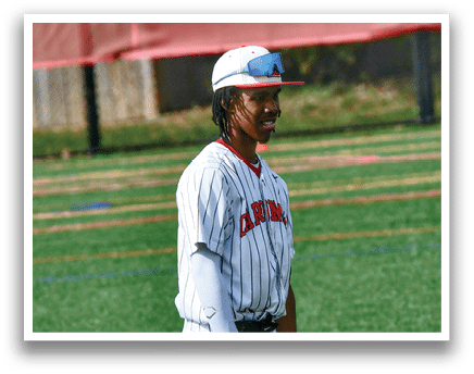 A baseball player standing on a field. Description generated by AI
