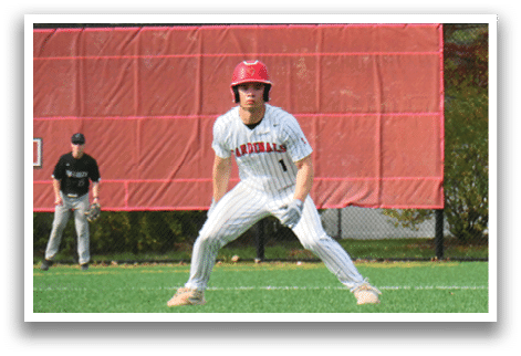 A baseball player in a red helmet and white uniform is ready to catch a ball. Description generated by AI