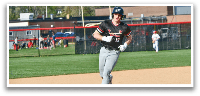 A baseball player running to a base. Description generated by AI