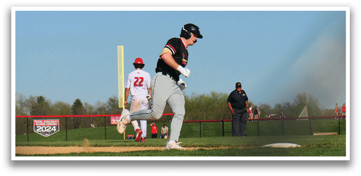 A baseball player running to first base. Description generated by AI