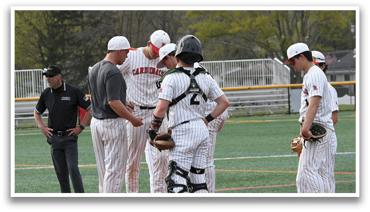 A group of baseball players on a field. Description generated by AI