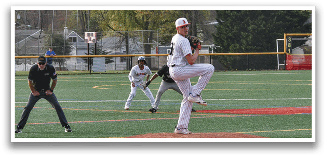 A baseball player in a white uniform is pitching a ball. Description generated by AI