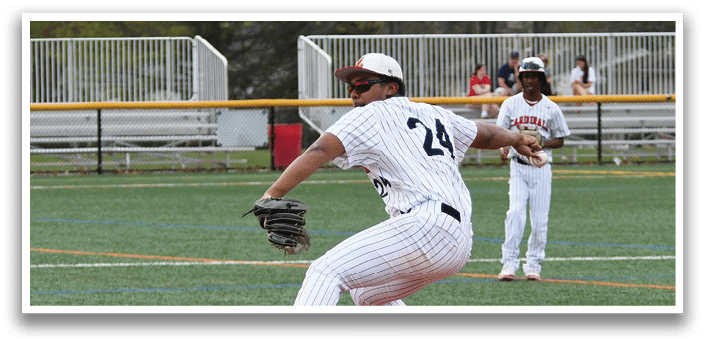 A baseball player in a white and black uniform is pitching a ball. Description generated by AI
