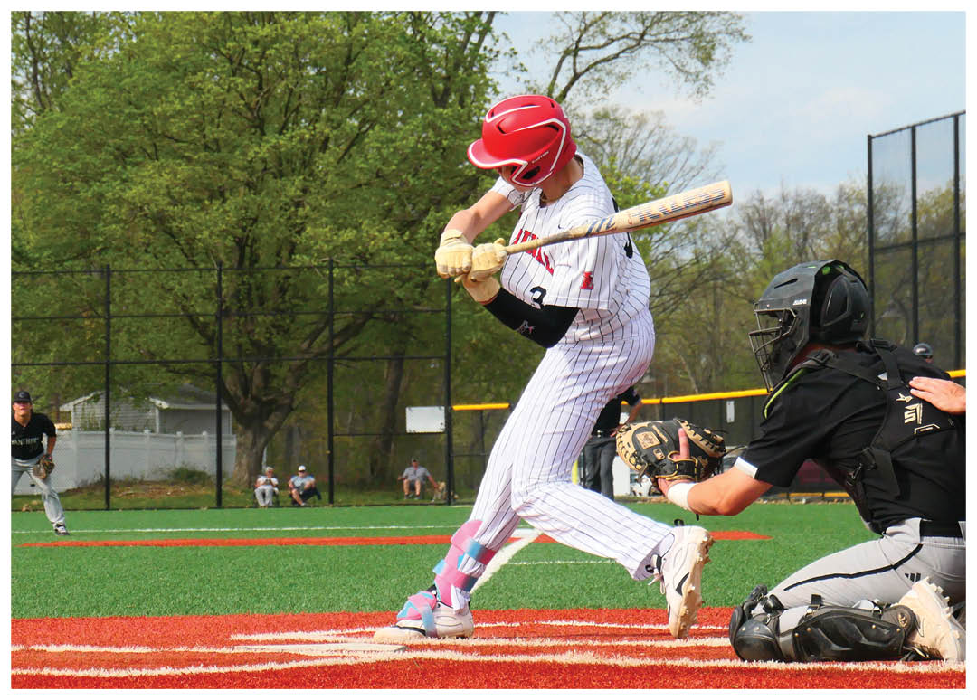 A baseball player is swinging a bat at a ball. Description generated by AI