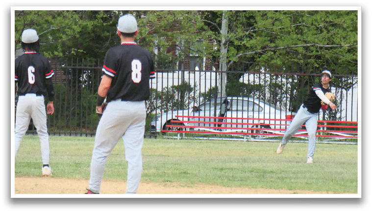 A baseball game is taking place on a field with a man holding a bat and another man wearing a baseball glove. Description generated by AI