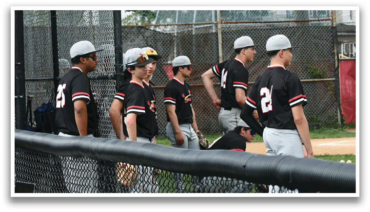 A group of baseball players wearing black shirts and hats. Description generated by AI