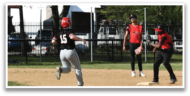 A baseball player running to a base. Description generated by AI