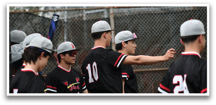 A group of baseball players wearing black shirts and hats. Description generated by AI
