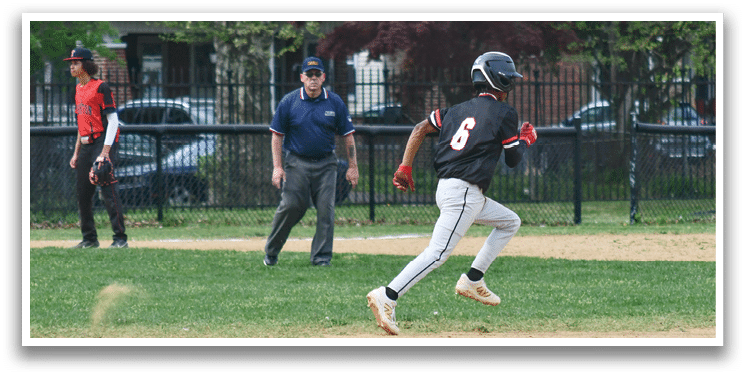 A baseball player running on the field. Description generated by AI
