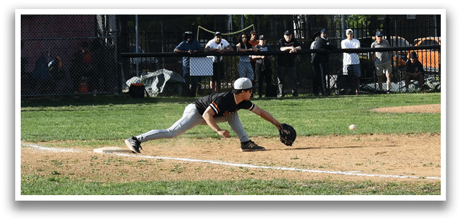 A baseball player sliding into a base. Description generated by AI