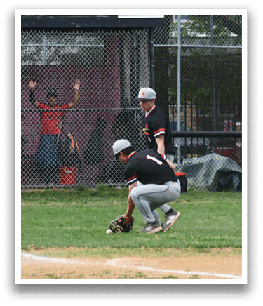 A baseball player is sliding into a base. Description generated by AI