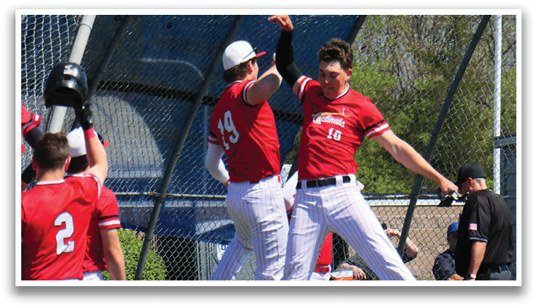 A group of baseball players celebrating a win. Description generated by AI
