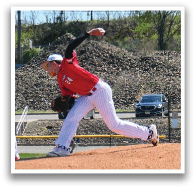 A baseball player in a red shirt and white pants is pitching a ball. Description generated by AI