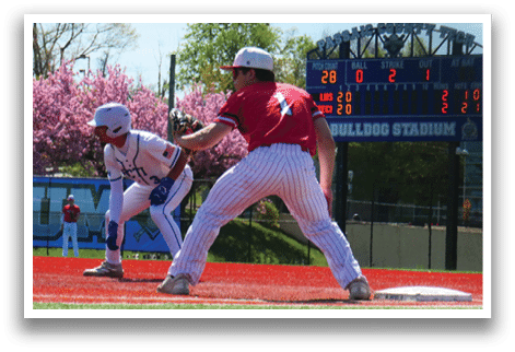 A baseball game is being played at a stadium. Description generated by AI