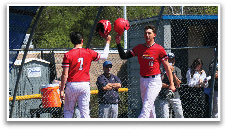 A baseball player wearing a red shirt and red shoes. Description generated by AI