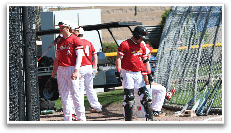 A group of baseball players standing on a field. Description generated by AI