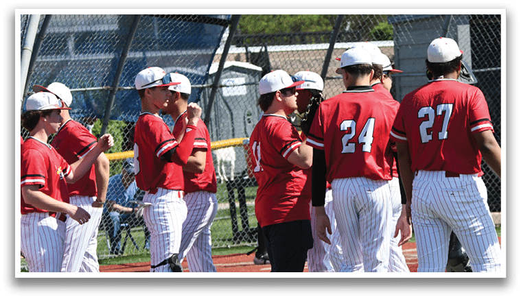 Baseball players in red and white uniforms. Description generated by AI