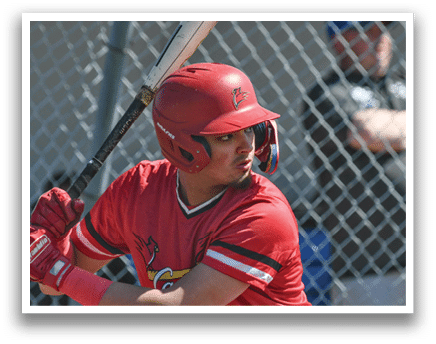 A baseball player in a red shirt and red helmet is swinging a bat. Description generated by AI
