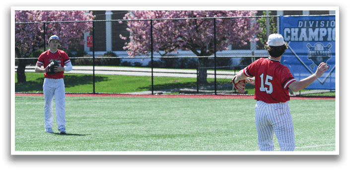Two baseball players on a field. Description generated by AI