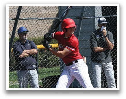 A baseball player in a red shirt and white pants is swinging a bat. Description generated by AI