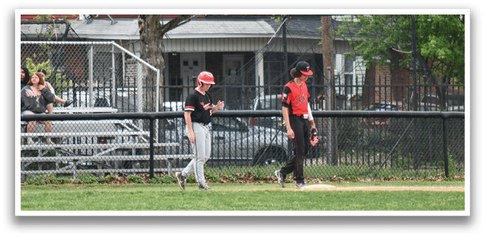 A baseball game is being played in a residential area. Description generated by AI