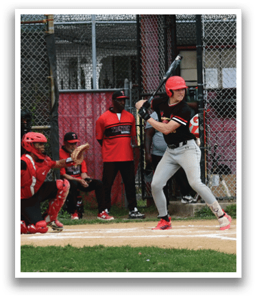 A baseball player is swinging a bat at a ball. Description generated by AI
