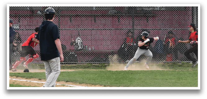A baseball game is taking place with a player running to a base. Description generated by AI