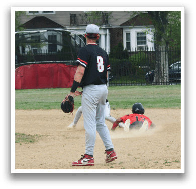 A baseball player is sliding into a base. Description generated by AI