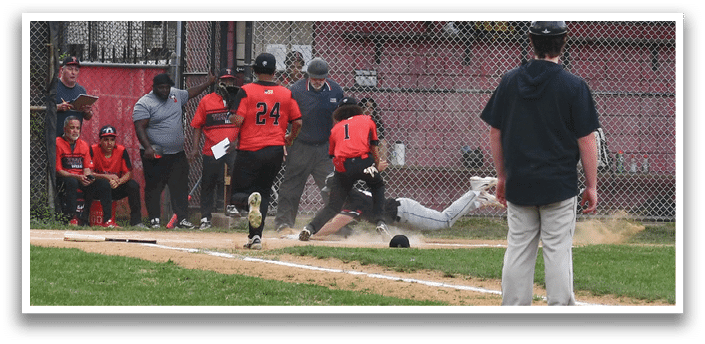 A baseball player slides into home plate. Description generated by AI