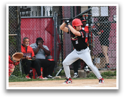 A baseball player is swinging a bat at a ball. Description generated by AI